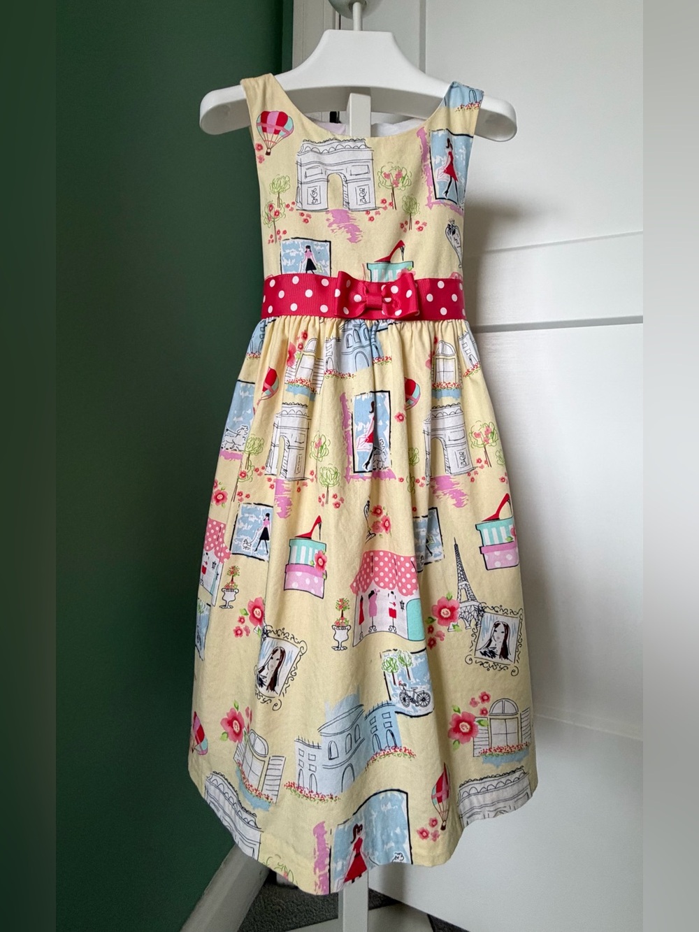 Bonnie Jean Yellow Sleeveless Paris Print Dress with Red Polka Dot Belt